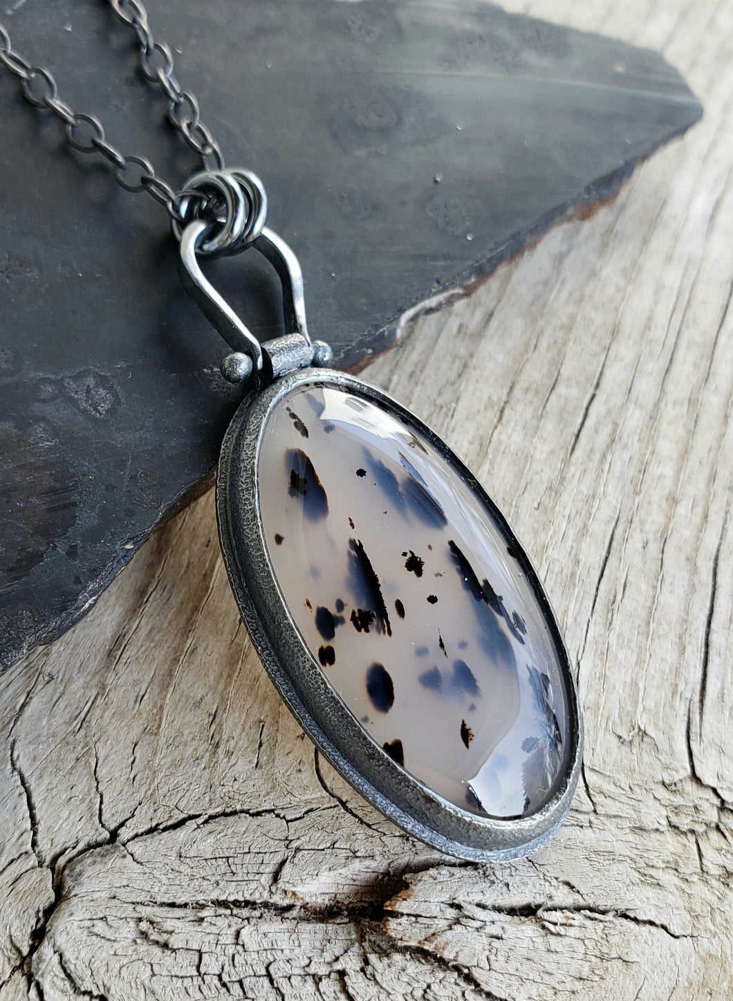 Spotty black and milky clear Montana Agate in blackened sterling silver