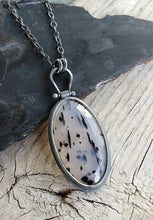 Load image into Gallery viewer, Spotty black and milky clear Montana Agate in blackened sterling silver